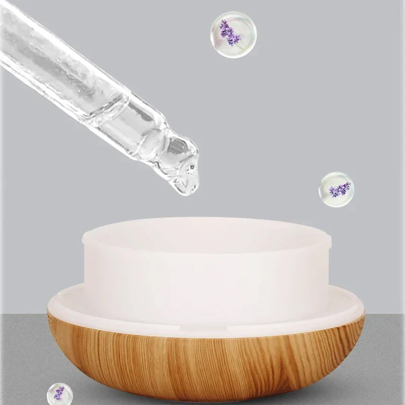 Créez une ambiance zen et apaisante dans votre intérieur avec ce diffuseur d’huiles essentielles 350ml au design grain de bois naturel. Fonction brumisation pour humidifier l'air -7 couleurs LED