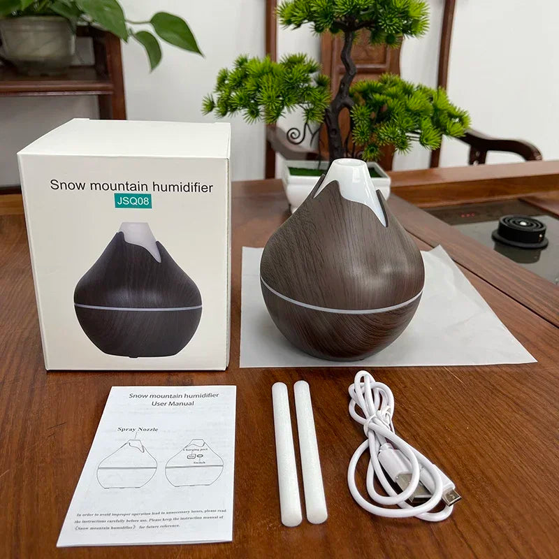 Créez une ambiance zen et apaisante dans votre intérieur avec ce diffuseur d’huiles essentielles 350ml au design grain de bois naturel. Fonction brumisation pour humidifier l'air -7 couleurs LED