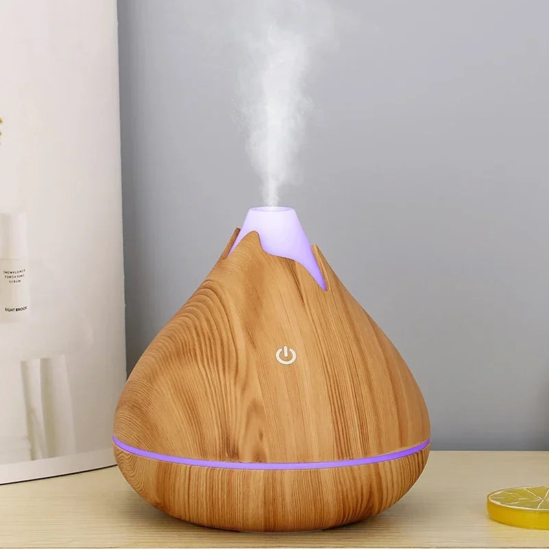 Créez une ambiance zen et apaisante dans votre intérieur avec ce diffuseur d’huiles essentielles 350ml au design grain de bois naturel. Fonction brumisation pour humidifier l'air -7 couleurs LED
