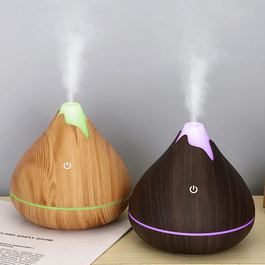 Créez une ambiance zen et apaisante dans votre intérieur avec ce diffuseur d’huiles essentielles 350ml au design grain de bois naturel. Fonction brumisation pour humidifier l'air -7 couleurs LED