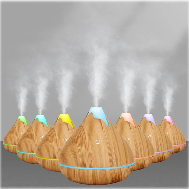Créez une ambiance zen et apaisante dans votre intérieur avec ce diffuseur d’huiles essentielles 350ml au design grain de bois naturel. Fonction brumisation pour humidifier l'air -7 couleurs LED
